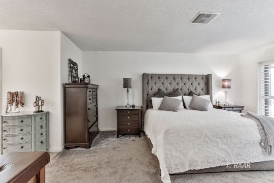928 Randall Street Ridgecrest, CA 93555 - Photo 23 of 34 a bedroom with a bed and a cabinets