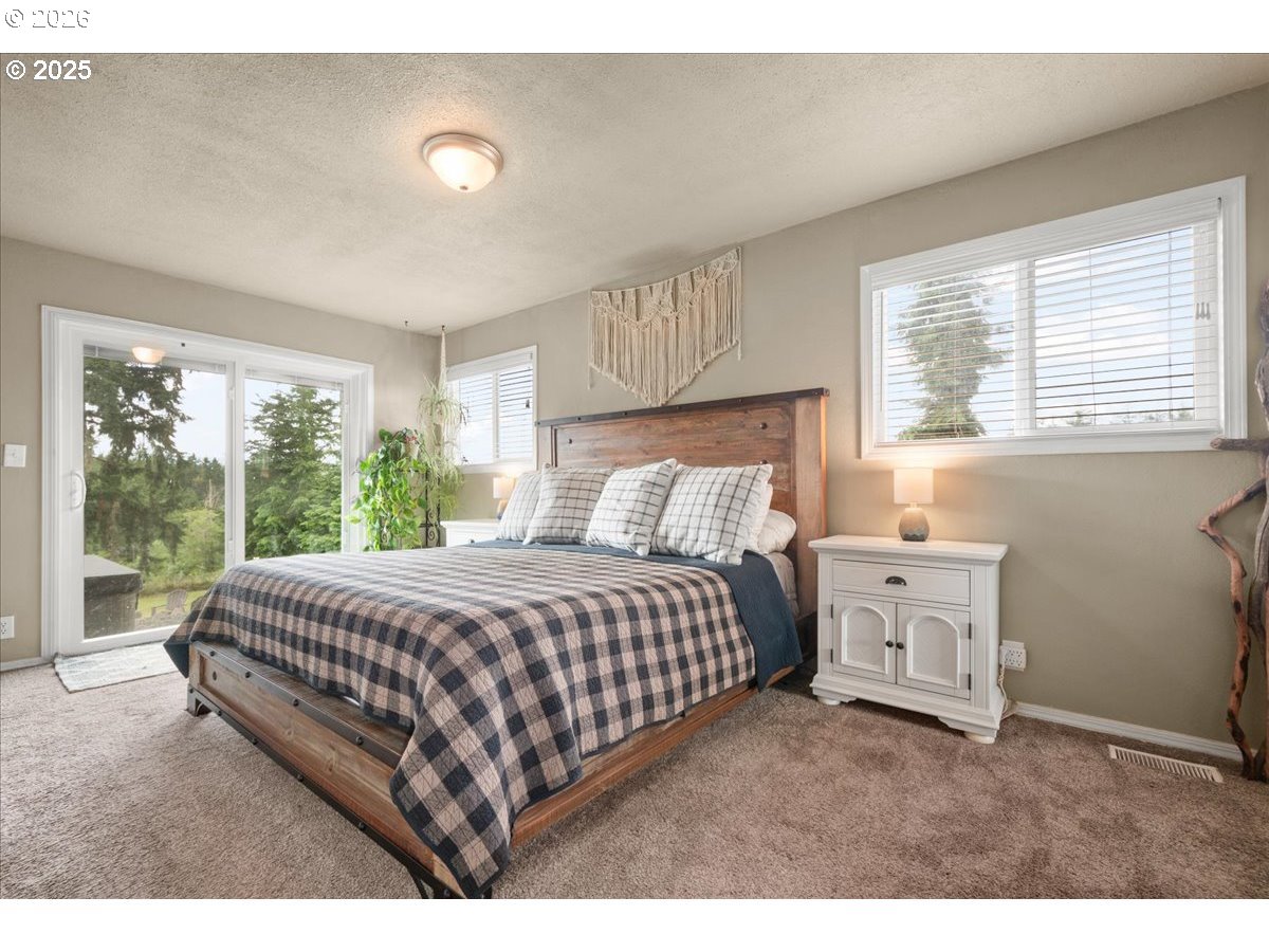 1415 Sightly Road Toutle, WA 98649 - Photo 12 of 36 a bedroom with a bed and a window