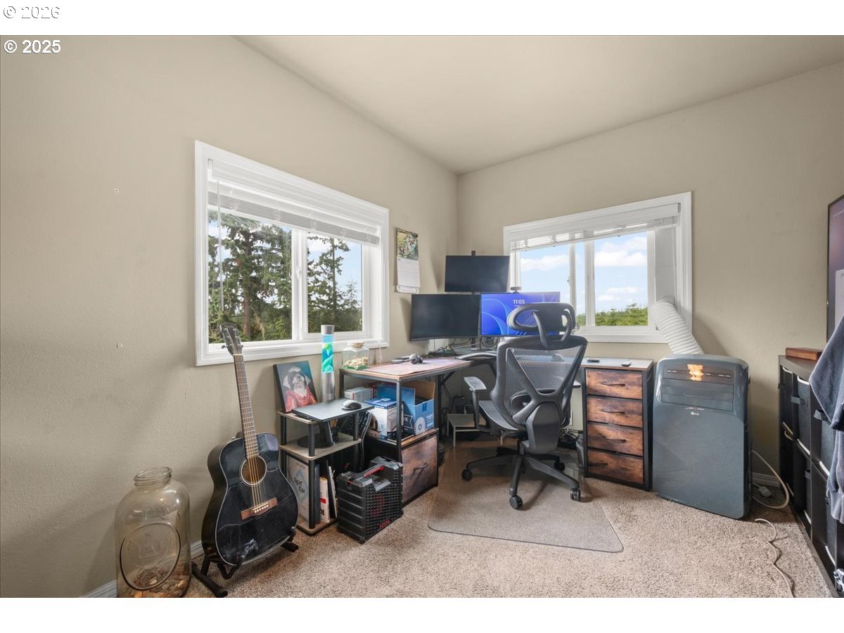 1415 Sightly Road Toutle, WA 98649 - Photo 22 of 36 a living room with furniture a flat screen tv and a window
