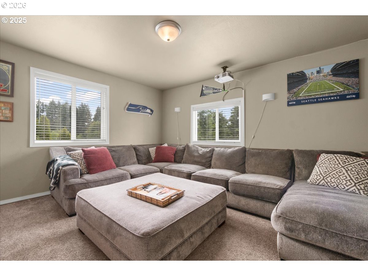 1415 Sightly Road Toutle, WA 98649 - Photo 8 of 36 a living room with furniture a large window and a rug