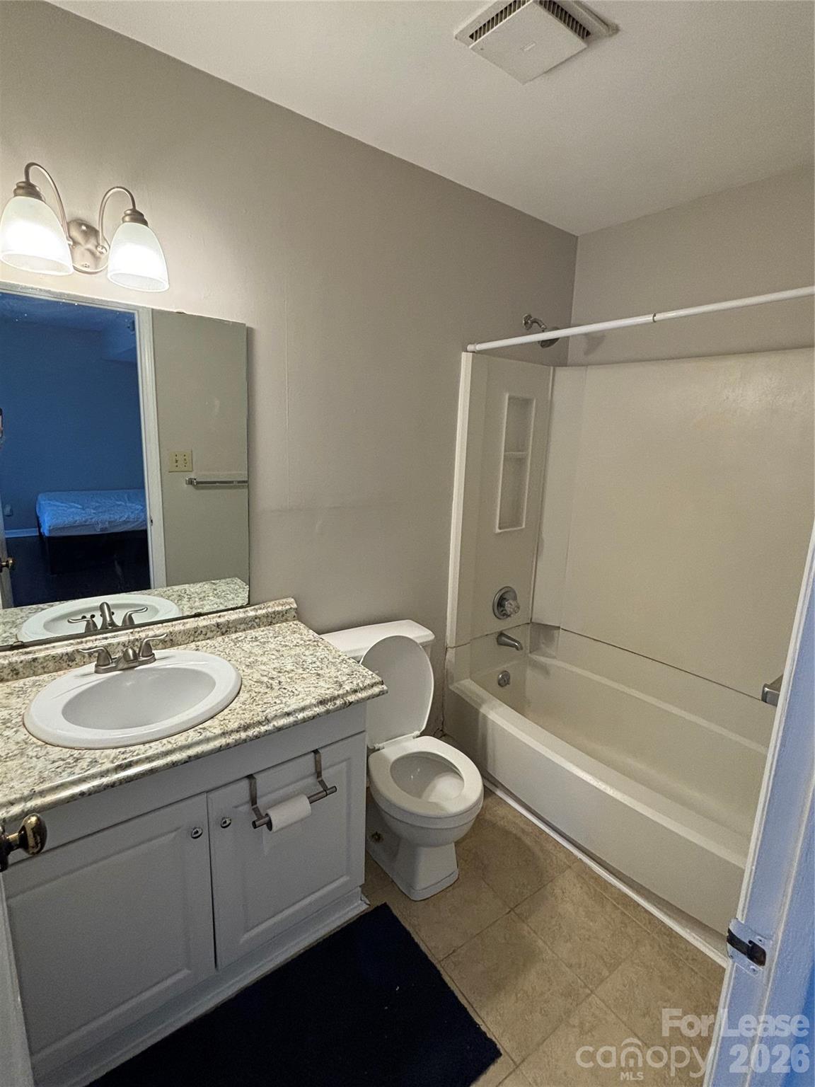 11040 Harrowfield Road Charlotte, NC 28226 - Photo 11 of 14 a bathroom with a granite countertop sink toilet and shower