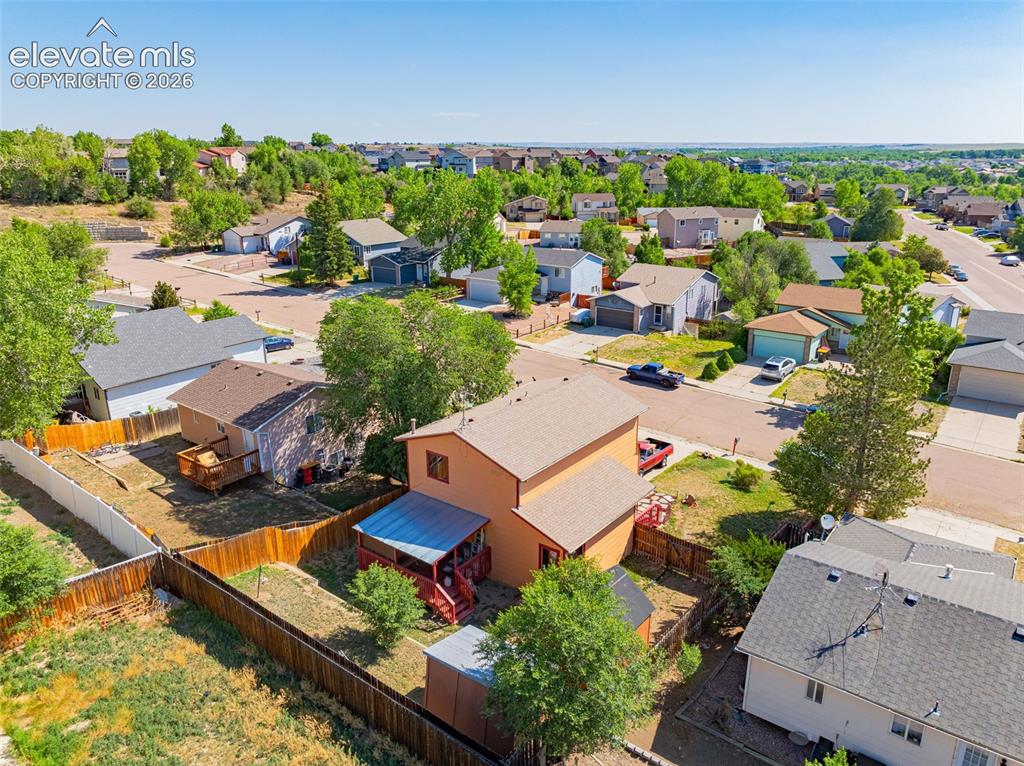 613 Wheat Field Road Fountain, CO 80817 - Photo 26 of 32 an aerial view of a house with a garden