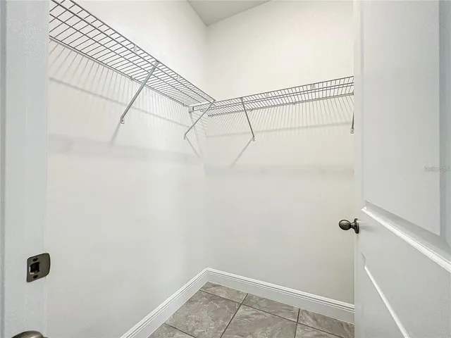 a view of a grassy field with trees