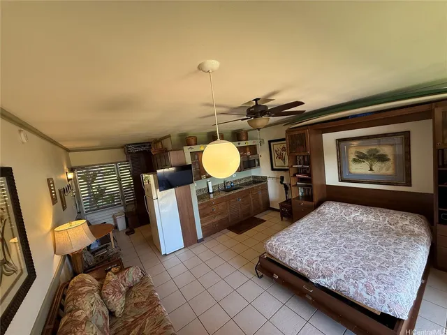 a kitchen with a refrigerator and cabinets