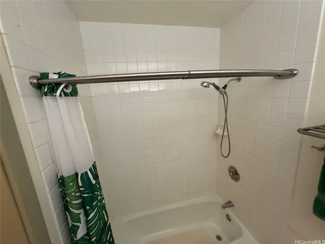 a view of ocean with green space