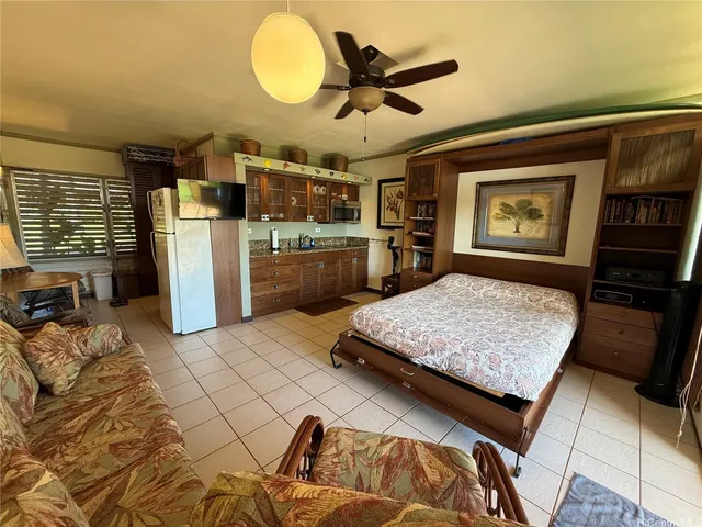 a kitchen with a sink and a refrigerator