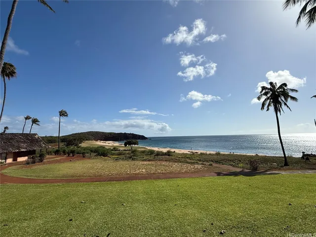 a kitchen with stainless steel appliances kitchen island granite countertop a refrigerator and a stove top oven