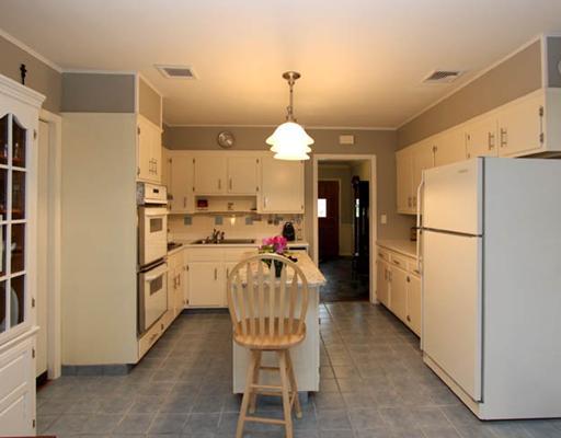 198 Valley Road Cos Cob, CT 06807 - Photo 4 of 11 a kitchen with refrigerator a sink and cabinets