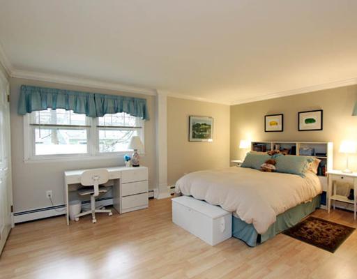 198 Valley Road Cos Cob, CT 06807 - Photo 7 of 11 a bedroom with a large bed and a window