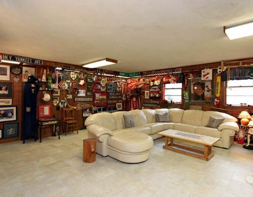 198 Valley Road Cos Cob, CT 06807 - Photo 9 of 11 a living room with furniture gym equipment and a large window