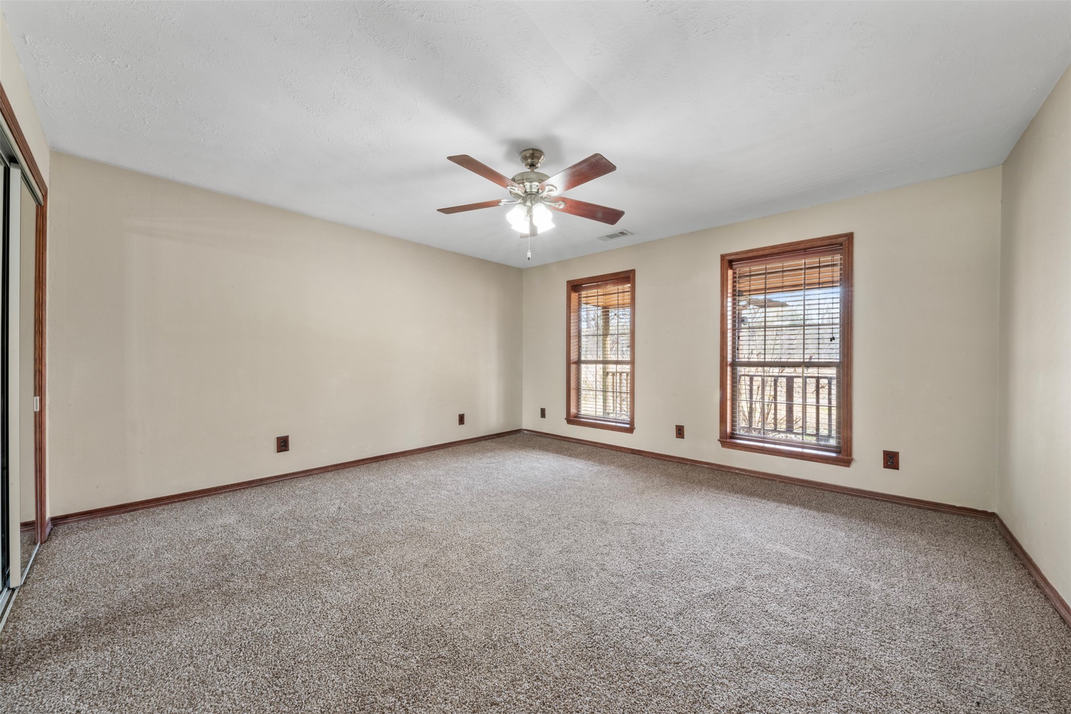 33349 Interstate 10 Hankamer, TX 77560 - Photo 11 of 28 a view of an empty room with chandelier fan and window