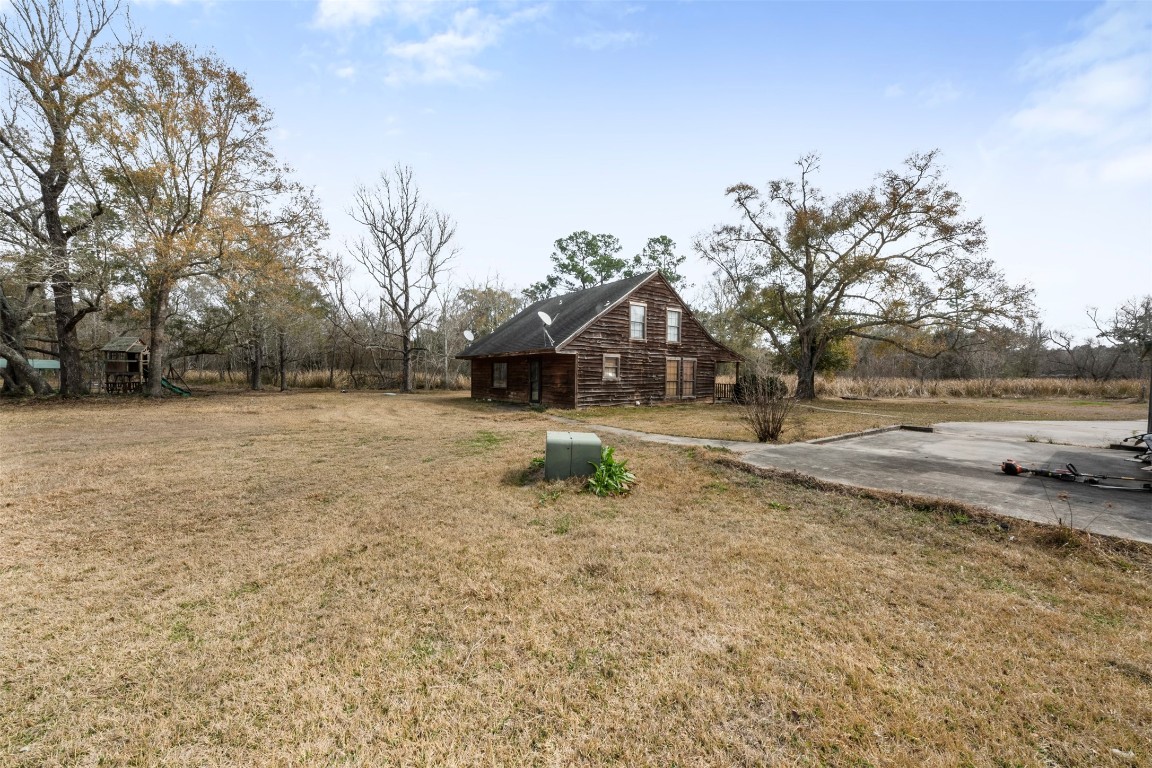 33349 Interstate 10 Hankamer, TX 77560 - Photo 20 of 28 a backyard of a house with lots of green space