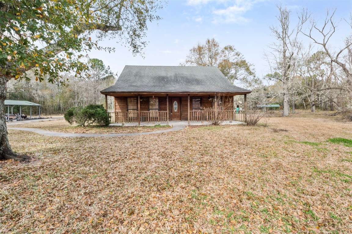 33349 Interstate 10 Hankamer, TX 77560 - Photo 2 of 28 a front view of a house with a yard