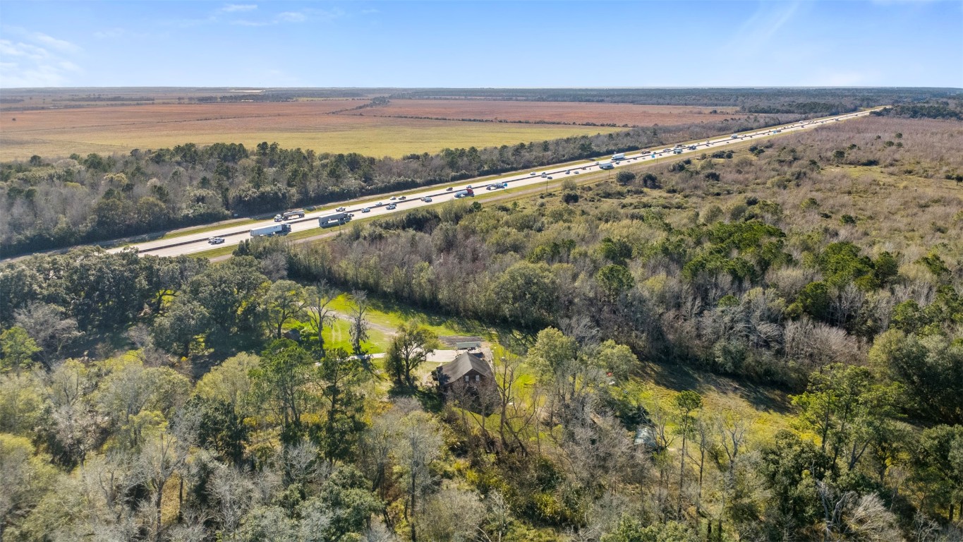 33349 Interstate 10 Hankamer, TX 77560 - Photo 23 of 28 a view of a lake from a yard