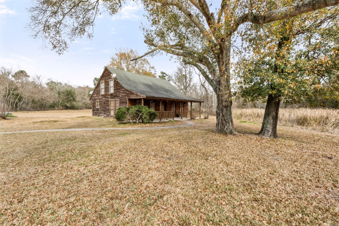 33349 Interstate 10 Hankamer, TX 77560 - Photo 3 of 28 a front view of a house with a yard