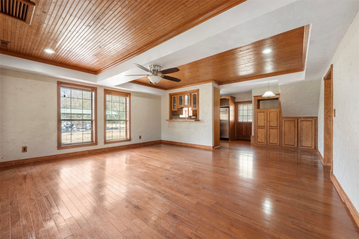 33349 Interstate 10 Hankamer, TX 77560 - Photo 5 of 28 a view of an empty room with a window and wooden floor