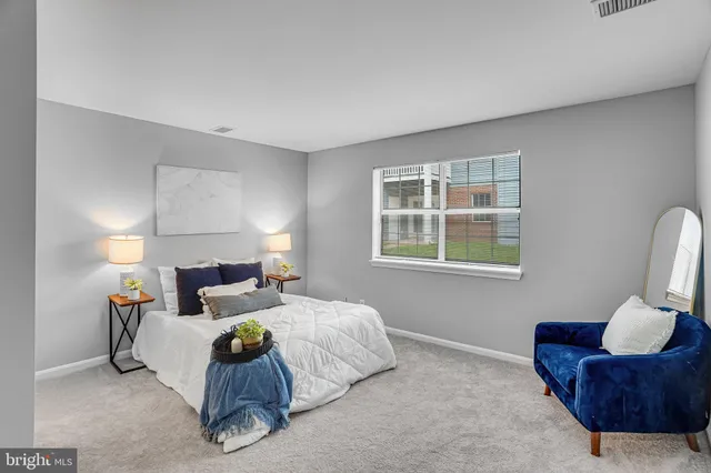 a bedroom with bed and a window