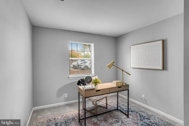 a view of a workspace with furniture