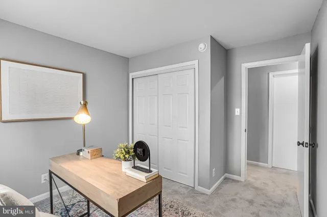 a workspace with furniture and a window