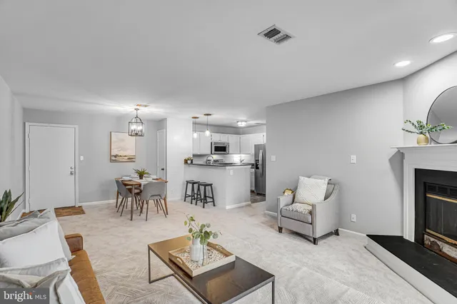 a living room with furniture and a table
