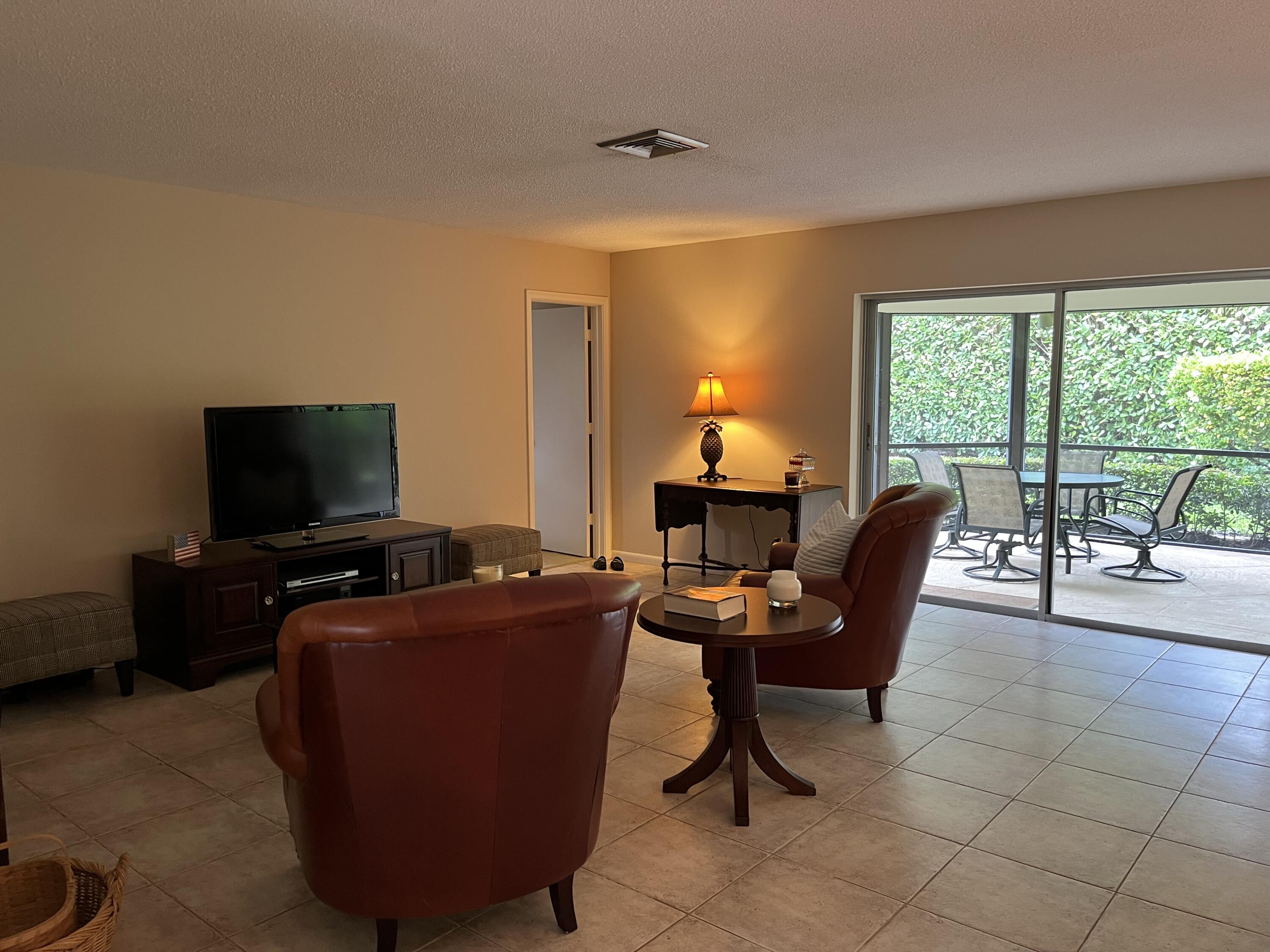 493 Forestview Drive Atlantis, FL 33462 - Photo 11 of 21 a view of a workspace with furniture and a window