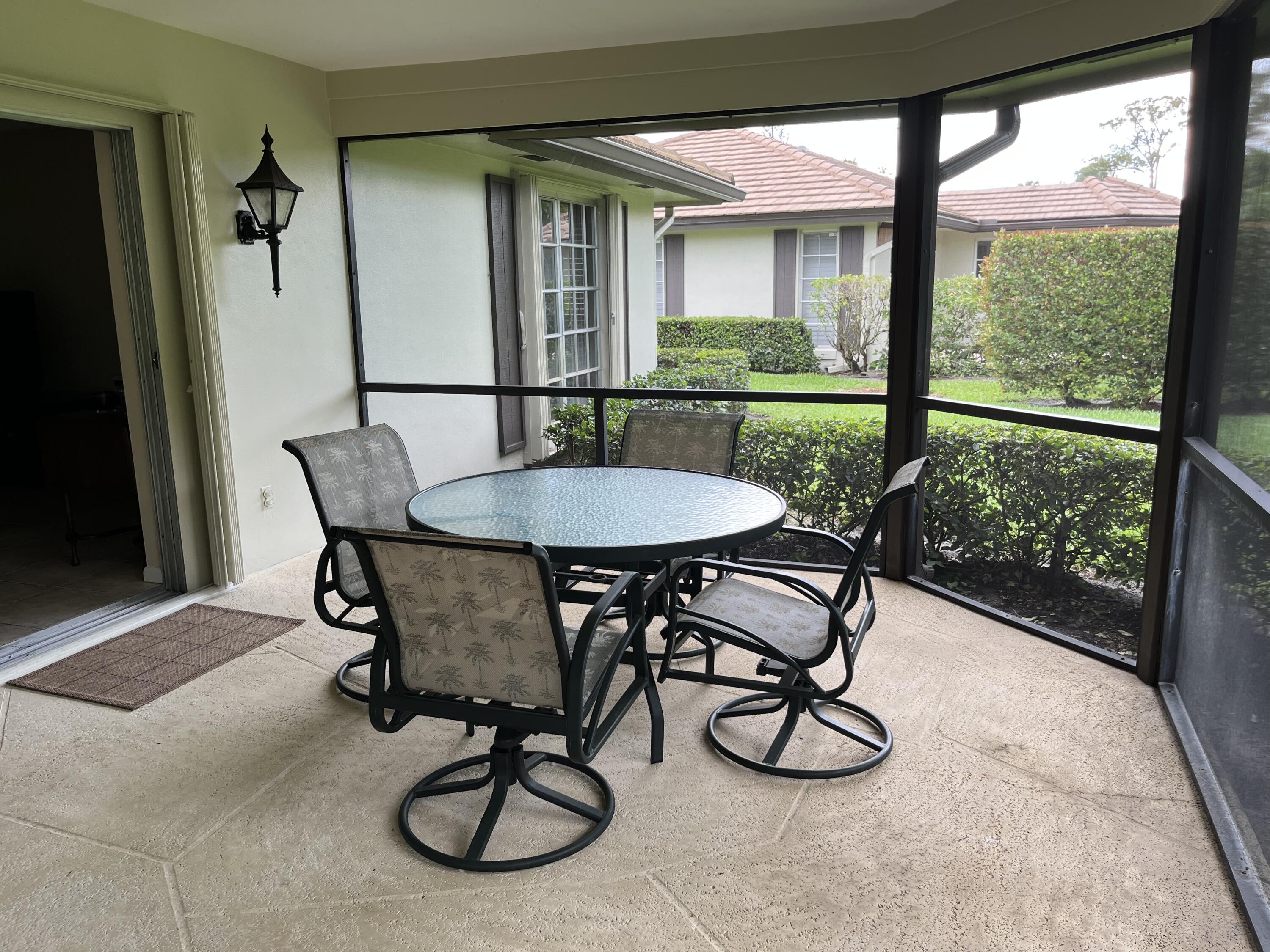 493 Forestview Drive Atlantis, FL 33462 - Photo 7 of 21 a view of a dining room with furniture window and wooden floor