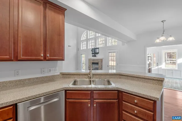 a view of a room with wooden floor and a window