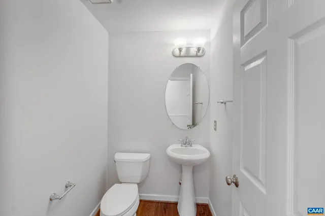 a view of a yard with wooden fence