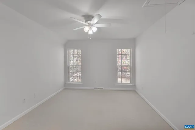 a view of a backyard with sitting area