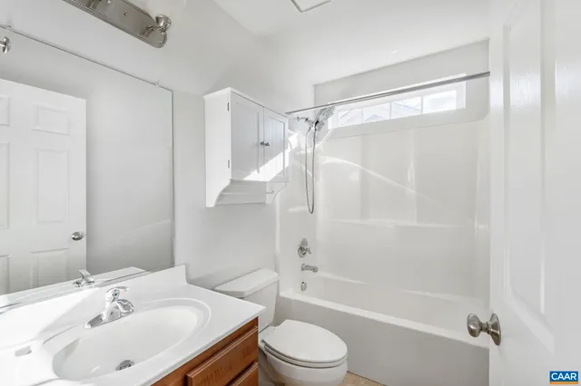 a tennis court with trees in the background