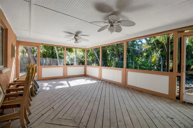 a view of a room with wooden floor and outdoor space