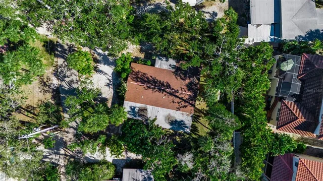 an aerial view of a house with a yard and garden