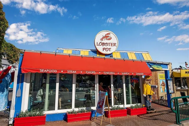 a view of a cafe with sitting area