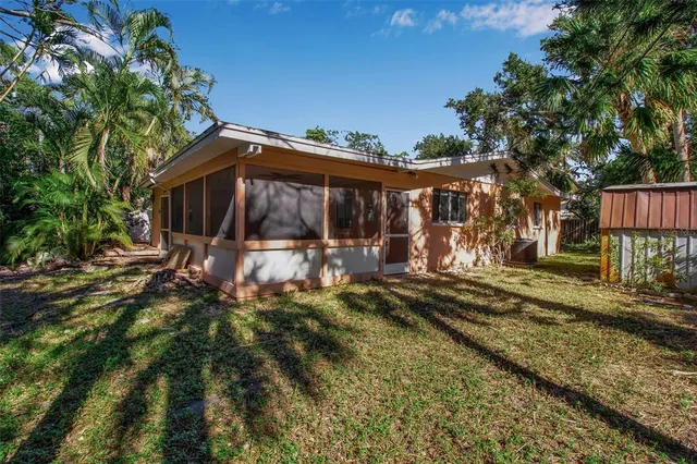 a view of a backyard with under an umbrella