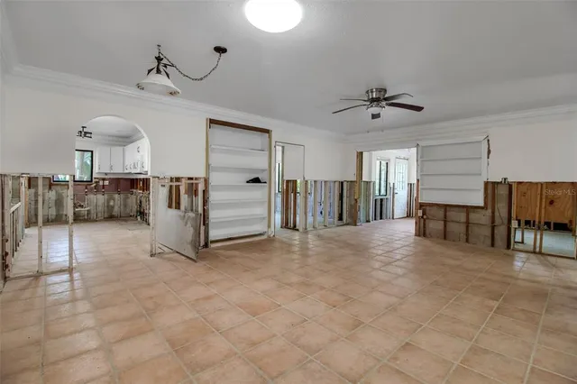a view of a livingroom with furniture and natural light