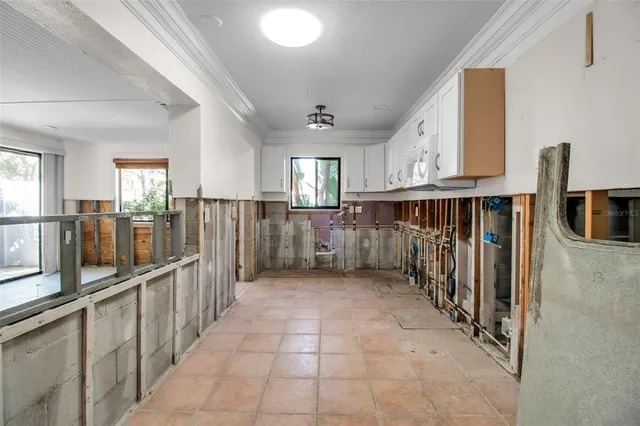 a view of a kitchen with a sink and cabinets