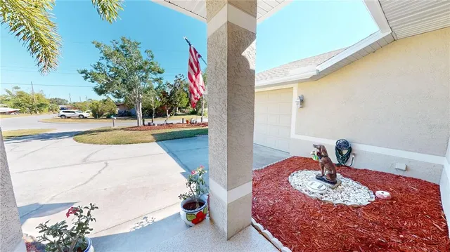 a bedroom with a bed and a potted plant