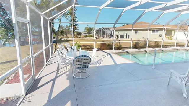 a view of a swimming pool with a patio