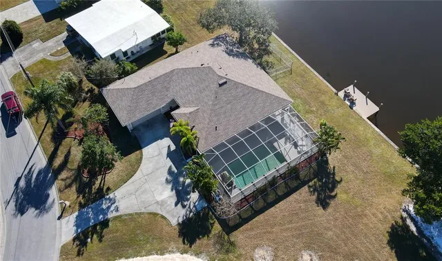 an aerial view of a house with outdoor space