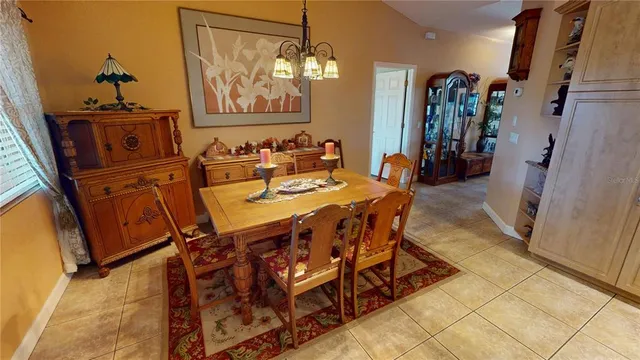 a view of a dining area with furniture and a window