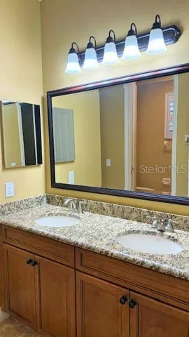 a bathroom with a sink and a mirror