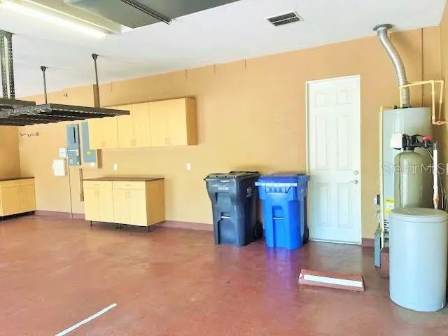 a view of a kitchen with furniture and a window