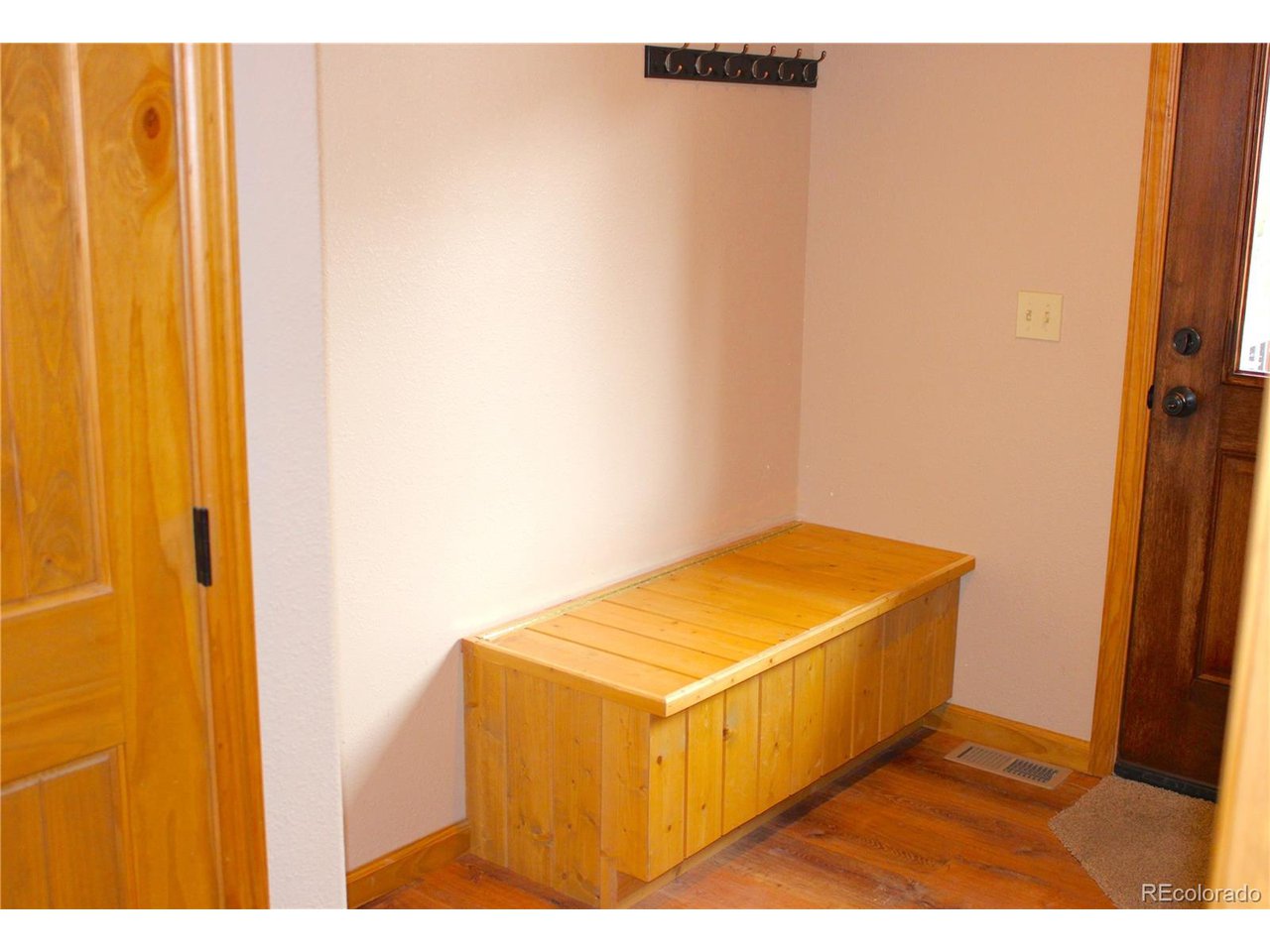 946 Singletree Road Hartsel, CO 80449 - Photo 31 of 50 Mud Room with Built-In Seating w Storage and also a Linen Closet.