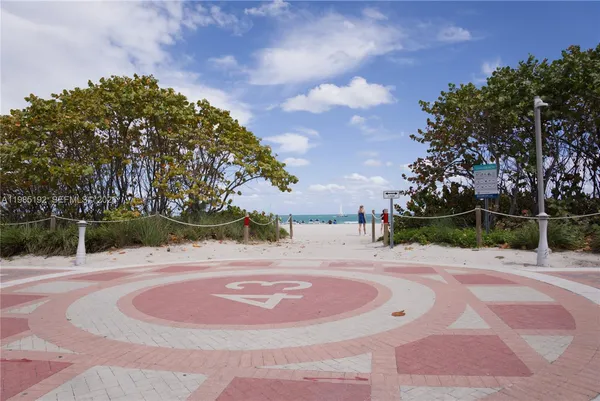 a swimming pool with an outdoor space and trees