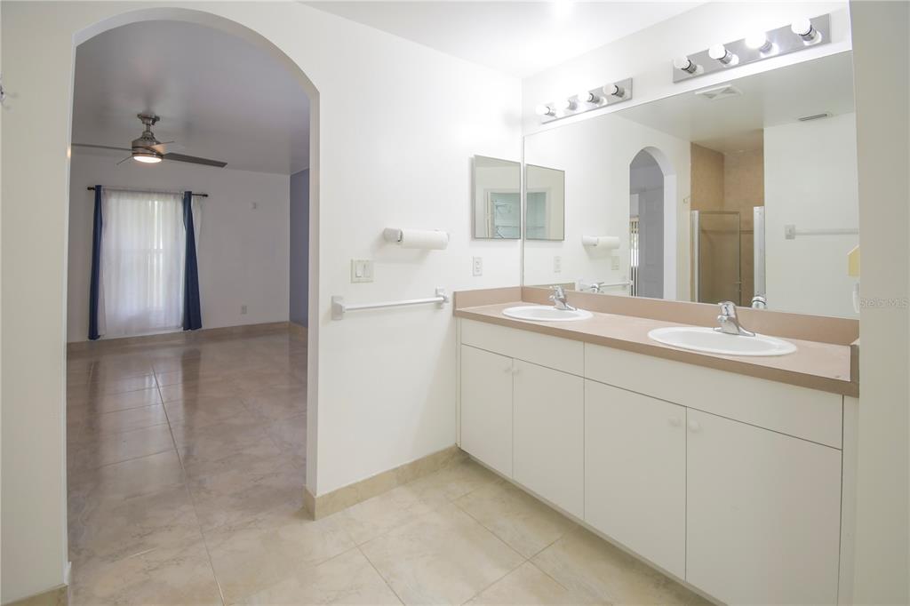 4913 Cromey Road North Port, FL 34288 - Photo 15 of 36 a bathroom with a sink and a mirror