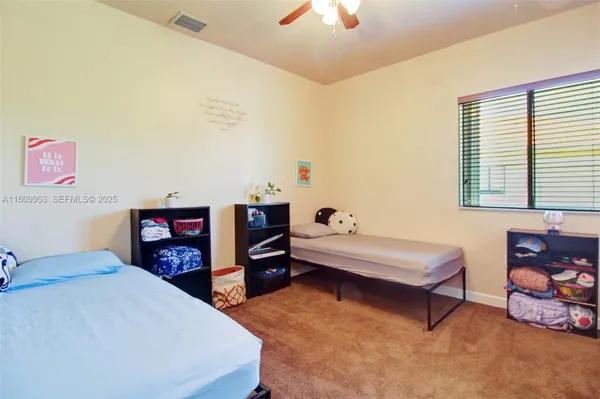 a bathroom with a sink and mirror with toilet