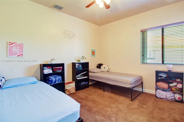 a bathroom with a sink and mirror with toilet