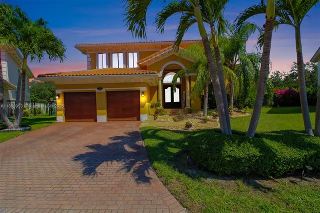 a front view of a house with a garden