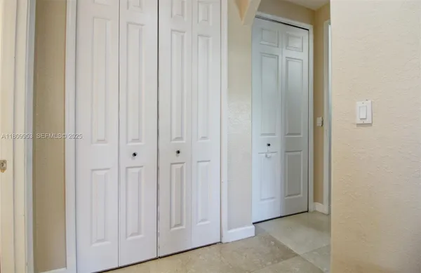 a bathroom with a toilet and a shower curtain