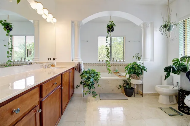 a bathroom with a toilet and a shower curtain
